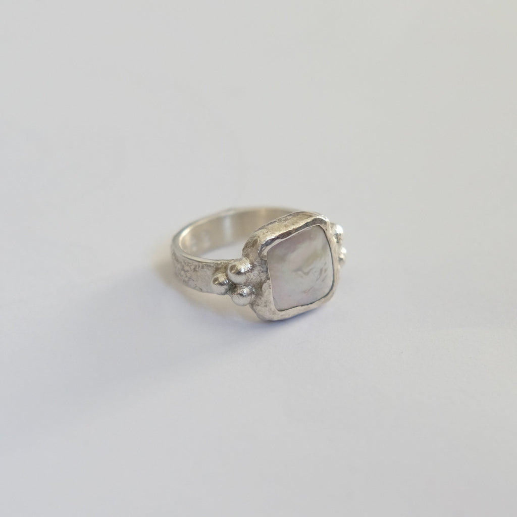 Her Pearl Ring