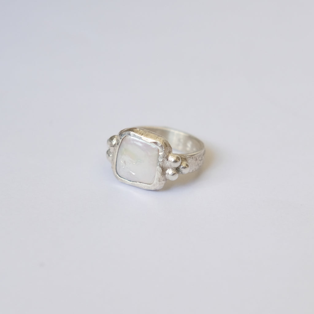 Her Pearl Ring